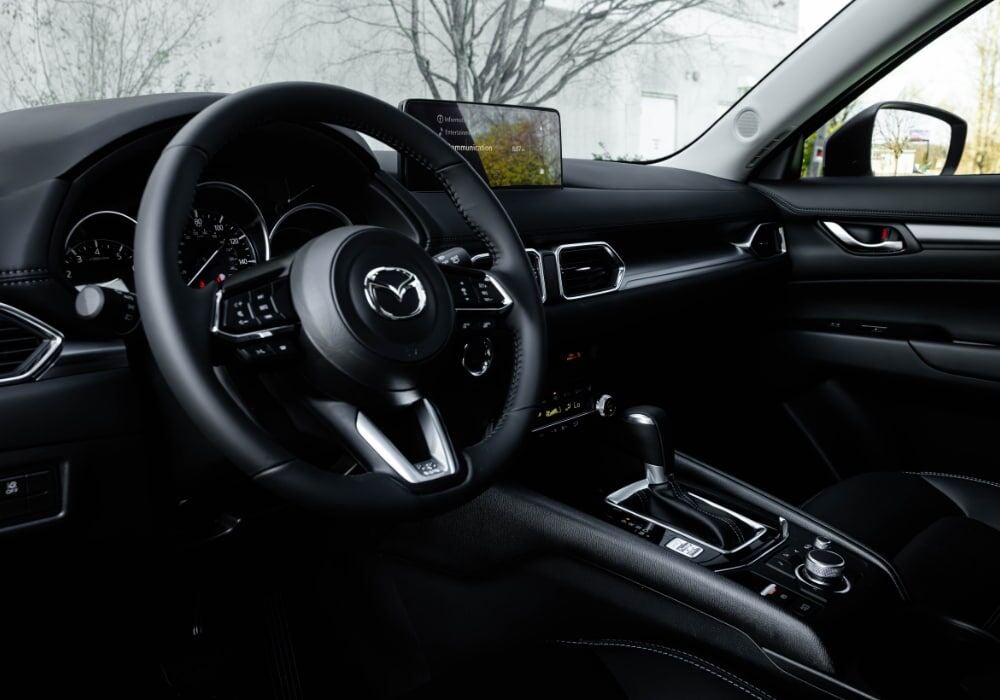 Mazda Cx-5 interior, including the steering wheel and infotainment system