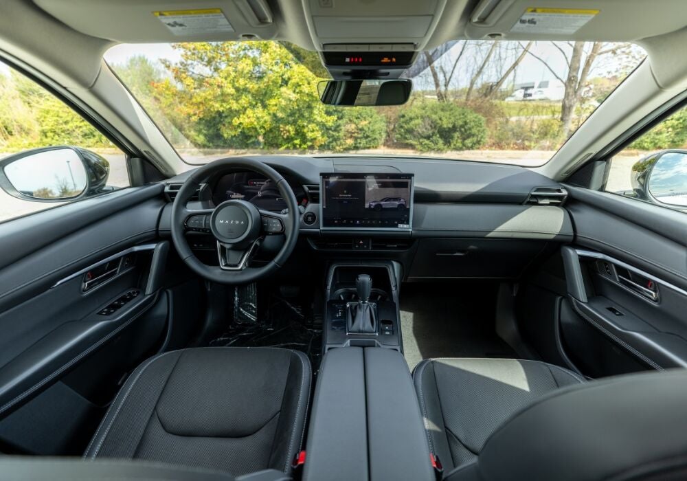 2026 Mazda CX-5 interior, featuring the infotainment system and steering wheel