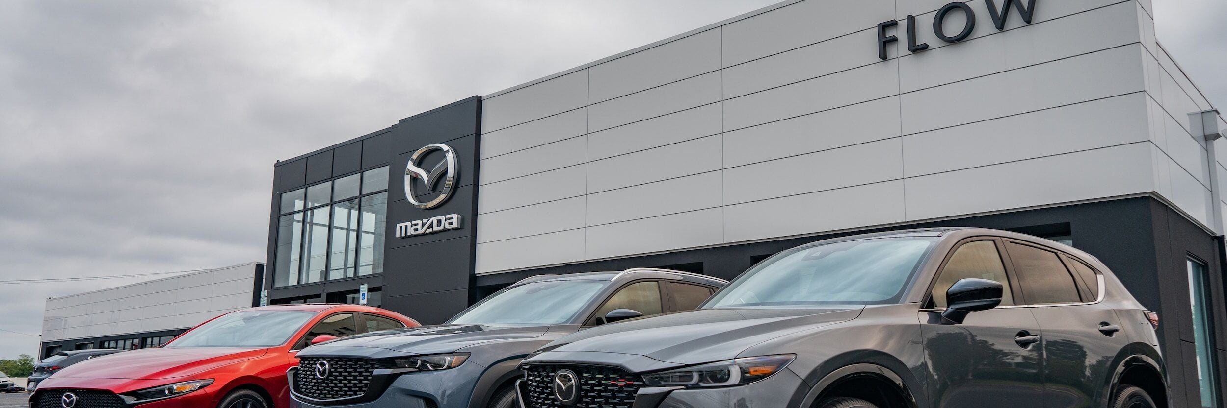 Storefront of Flow Mazda dealership in Fayetteville NC